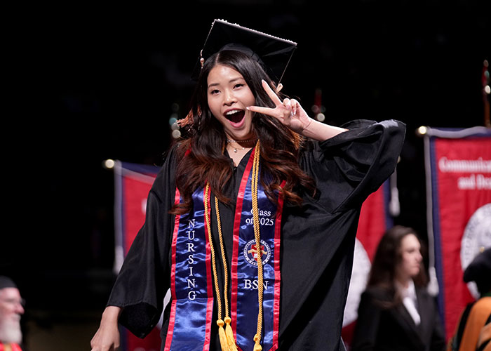 Graduate walking across stage
